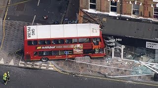 Bus crashes into shop on busy London high street [upl. by Enawtna]