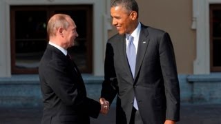 Obama and Putin greet with long handshake [upl. by Olrak]