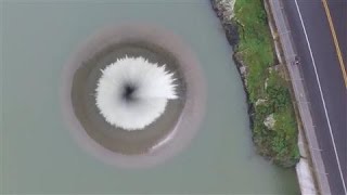 Drone Films Lake Overflowing Into California Spillway [upl. by Nawk724]