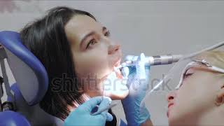 Girl at the dentist her teeth are drilled to receive amalgam filling [upl. by Erasme]